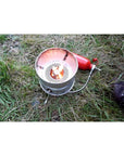 Trangia Multifuel Burner X2 Camping Stove (Red/Silver) being used