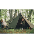 Robens Green Cone PRS Tipi Tent (2024) couple sitting in the woods